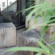 Green oak cubes for seating on the roof garden